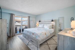 a bedroom with a bed and a large window at Steps 2 beach Ocean view Pool Parking in Brigantine +42 photos