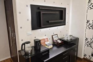 a room with a black desk with a coffee maker on it at Arabella Residence 2BR - New Cairo Luxury Stay in Cairo