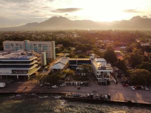 an aerial view of a building with a parking lot at Mountain View Studio at Marina Spatial - 300 Mbps, Pool, near Boulevard in Dumaguete
