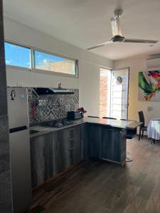 a kitchen with a sink and a counter top at comfortable and nice loft, great location in Aguascalientes
