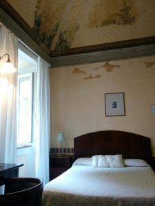 En eller flere senger på et rom på Villa Palagione Centro Interculturale