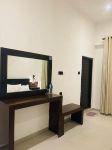 a mirror on a wall in a room at Luminozo Beach Hotel in Weligama +69 photos
