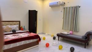 a bedroom with a bed and toys on the floor at YELAGiRI GRAND PALACE in Yelagiri