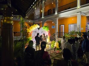a group of people standing around in a building at De Asian Resort in Pondicherry +52 photos