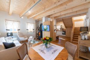 a living room with a couch and a table at Ebner 1822 in Gnesau