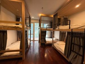 a room with four bunk beds in it at Spuds&Bunks Hostel in Hanoi