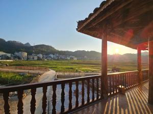 a porch of a house with a view of a field at PiTu Homestay in Dồng Văn
