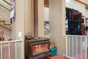 a stove sitting on the side of a house at Paradise in the city in Christchurch
