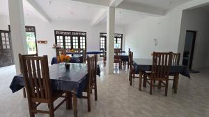 a dining room with a table and some chairs at Stay Suite in Mahiyangana