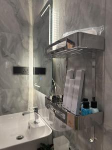 a bathroom with a sink and a mirror at Dilaro Rest & Villa in Kottagoda +87 photos