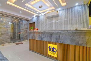 a fast food restaurant with a yellow sign on a counter at FabHotel Disa in kolkata