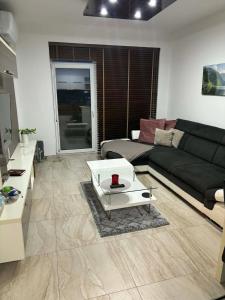 a living room with a couch and a coffee table at Súkromný apartmán in Senec