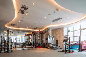 a gym with several treadmills and machines in a room at Best Western Plus Addis Ababa in Addis Ababa