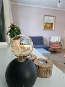 a glass ball on a table in a living room at Cottage Lake view Dalarna - Tolvsbo in Söderbärke