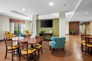 a dining room with a table and chairs at Sleep Inn & Suites Jasper I-22 in Jasper