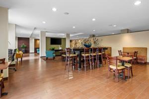 a dining room with a table and chairs at Sleep Inn & Suites Jasper I-22 in Jasper
