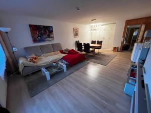 a living room with a couch and a table at Ferienwohnung Schöne Aussicht in Todtmoos