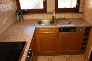 a kitchen with a sink and a counter top at Ferienwohnung Wehra in Todtmoos in Todtmoos +47 photos