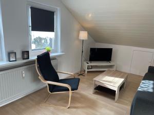 a living room with a couch and a table at Ferienwohnung Wehra in Todtmoos in Todtmoos