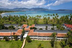 an aerial view of a resort with the ocean in the background at Wyndham Alltra Samana All Inclusive Resort in Las Galeras