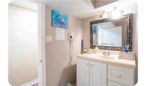 a bathroom with a sink and a mirror at Bright Room in Walkout Basement in Pickering +13 photos