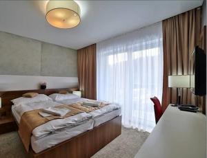Voodi või voodid majutusasutuse Hotel Alexander toas +24 fotot