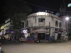 a building on a city street at night at Shree Residency in Airoli