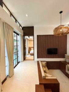 a living room with a couch and a fireplace at Brio de Agoho in Candelaria
