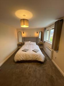 a bedroom with a large bed in a room at Caledonian Lock House in Caol