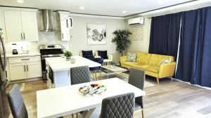 a kitchen and living room with a table and chairs at Gillespie Dr 2BR 1BA Unit A | Near Downtown SD in Spring Valley
