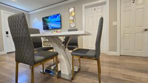 a table and two chairs in a room at Gillespie Dr 2BR 1BA Unit A | Near Downtown SD in Spring Valley