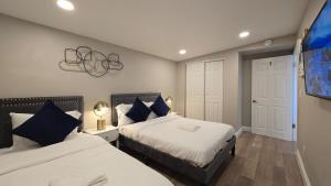 a bedroom with two beds and a tv at Gillespie Dr 2BR 1BA Unit A | Near Downtown SD in Spring Valley