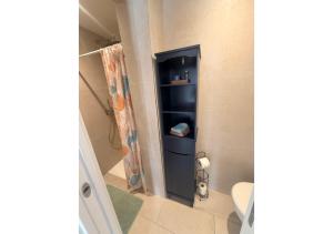 a bathroom with a shower and a toilet in a room at La maison des vacances in Menton +34 photos