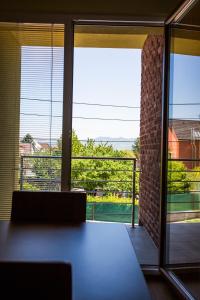 a room with a large window with a view at Vendelin Apartmany in Bojnice