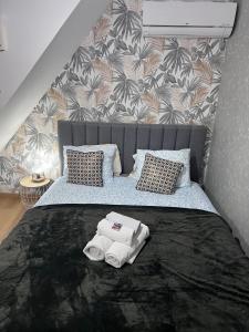 a bedroom with a bed with towels on it at coração alfama in Lisbon