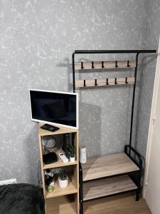 a bedroom with a bunk bed with a television and a desk at coração alfama in Lisbon