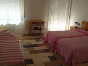 Katil atau katil-katil dalam bilik di Albergo Drena