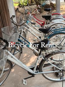 a group of bikes parked next to each other at Noupad sunset Guesthouse in Don Det
