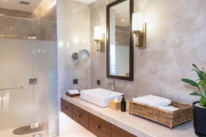 a bathroom with a sink and a mirror at Dusit Thani Himalayan Resort Dhulikhel, Nepal in Dhulikhel