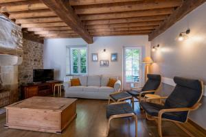 a living room with a couch and a table at Montauvert in Montel-de-Gelat