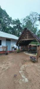 a man standing in front of a hut at Mango Mango in Tangalle +23 photos
