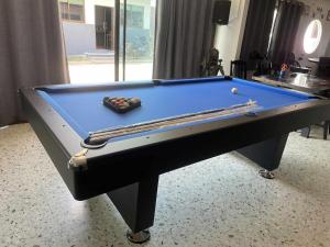 a pool table with two balls on top of it at Saensuk stay in Ban Wang Thong