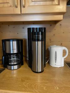 two coffins and a coffee maker on a kitchen counter at Haus Zirbennest in Zlem