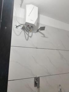 a glass table with a laptop on top of it at Ramashraya in Indore