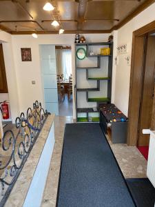 a room with a staircase and a room with a table at Ferienhaus Holiday in Radstadt +26 photos