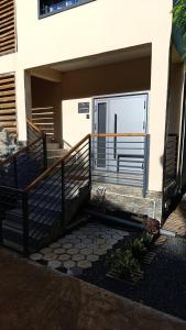 a front door of a house with a porch at Résidence LE MÄYSA in Sada