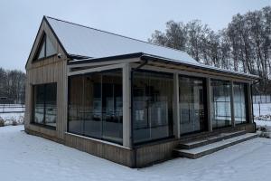 a screened in house in the snow at Forrestia - osada turystyczna in Czaplinek