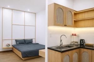 a bedroom with a bed and a sink in a room at B'lao Eco Lodge in Bảo Lộc +26 photos