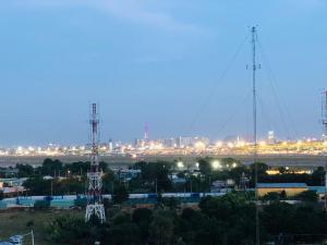 a city skyline at night with two communication towers at Homestay 150 in Ho Chi Minh City +9 photos