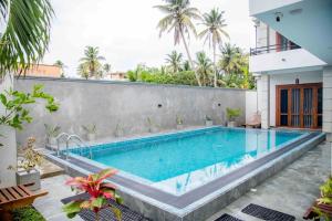 a swimming pool in the backyard of a house at Rest Ahangama in Ahangama